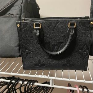 Louis Vuitton onthego pm purse.